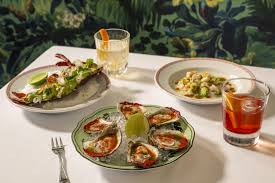 Chateau ZZ's signature dishes Coconut Snapper Ceviche, Little Neck Clam Aguachile, Michelada Oysters, and Duck Carnitas.